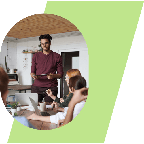 Man standing talking to group at table   image-square-lg-01-2